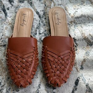 Wonderly women’s brown Etta Mules with a woven vegan leather upper slide on